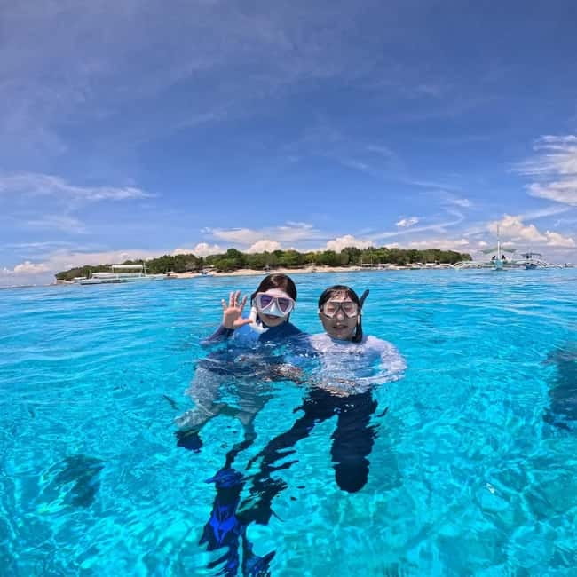 BOHOL: Dolphin Watching, Turtle Swim and Party Boat - Meeting at Alona Beach