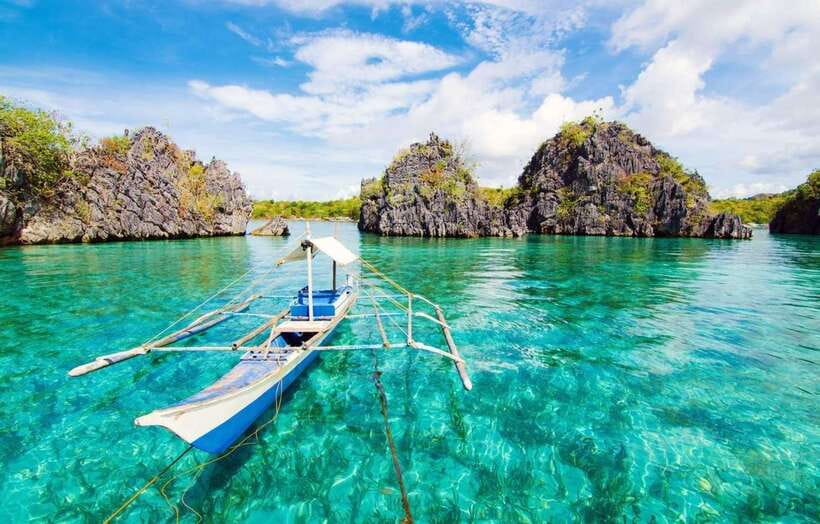 Coron: Coastal Cliffs, Beach & Malcapuya Island Hopping Tour - The local banca ride is part of the experience