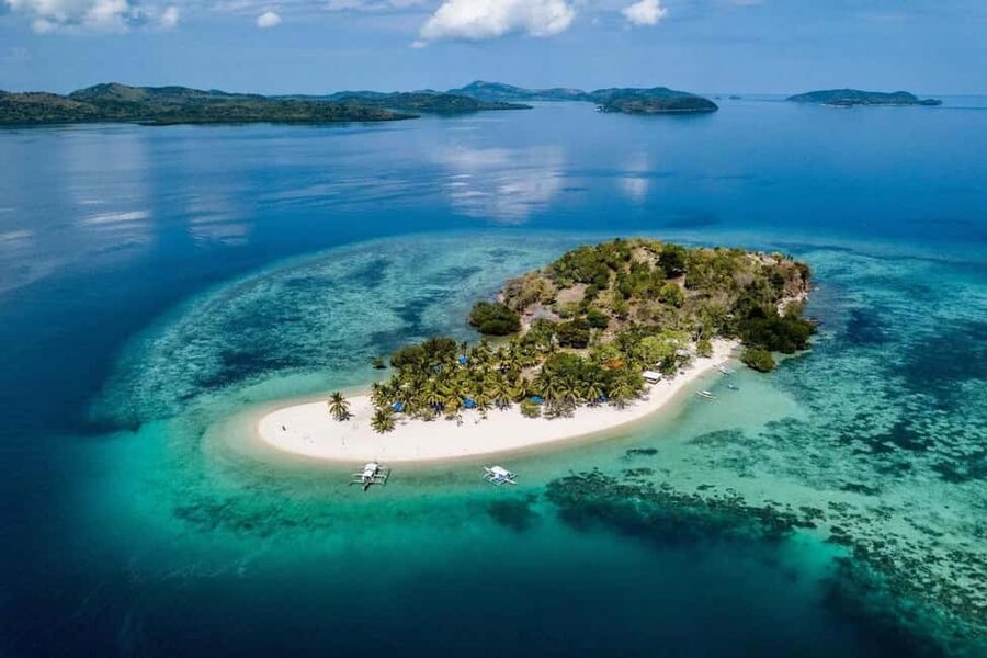 Coron: Reefs and Wrecks Tour with Snorkeling Equipment - Lusong Gunboat: a wreck with coral growing around it