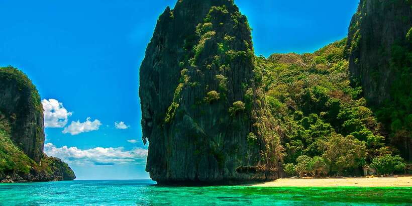 El Nido: Island Hopping Tour A Lagoons and Beaches - Seven Commandos Beach: coconut trees and white sand