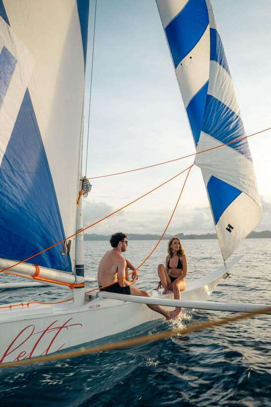 El Nido Islands: Private Paraw Sunset Sailing - Boarding a traditional paraw on Bacuit Bay