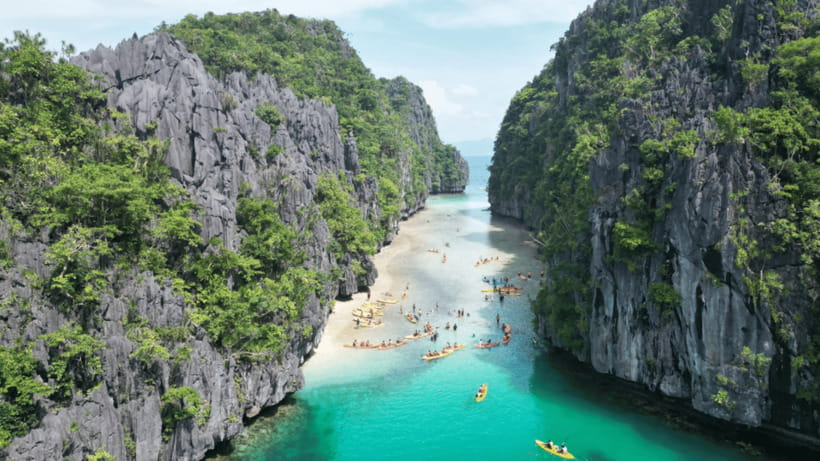 El Nido: Secret Lagoon Island Hopping with Lunch - Big Lagoon: cliffs, calm water, and an optional kayak