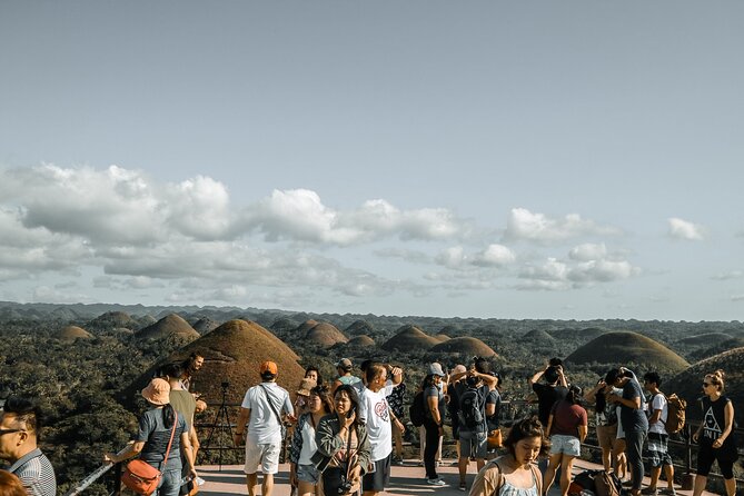 Famous Bohol Chocolate Hills Loboc River Cruise Tarsier Tour - Crossing the Sipatan Twin Hanging Bridge