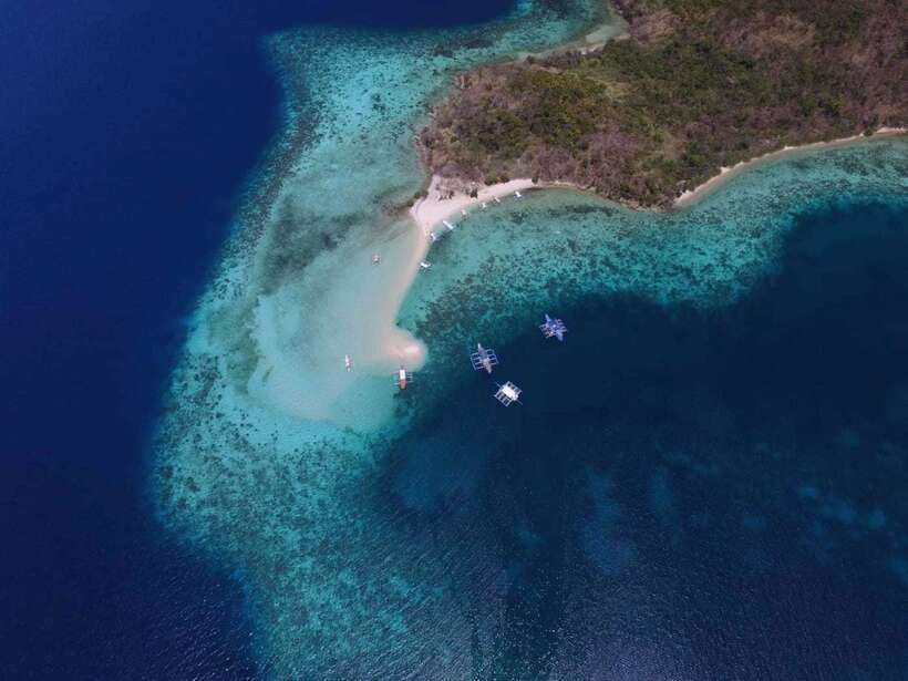 From Coron: Private Island-Hopping Cruise with Lunch - Banana Island and its curved strip of sand