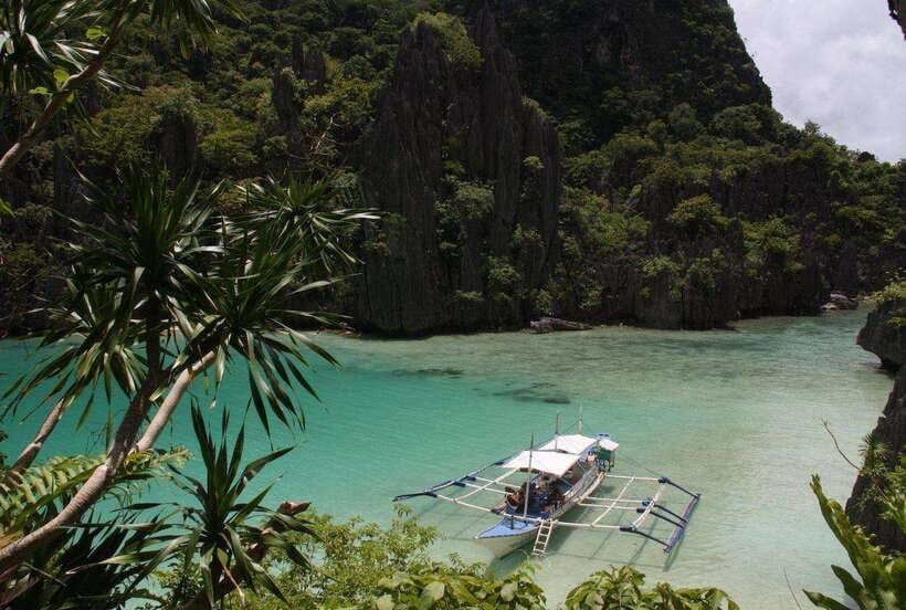 From El Nido: Island, Lagoons, and Beaches Boat Tour - Cadlao Lagoon and the big cliff views