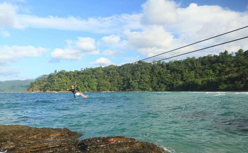 Puerto Princesa: Underground River, Zipline, Paddleboat Tour - Arriving at Sabang Beach