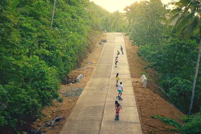 Siargao : Sunset 2 Hours Guided Electric Skate Experience - Crossing Catangnan Bridge near sunset
